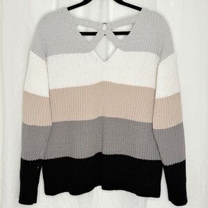 V neck with crisscross detail in back.